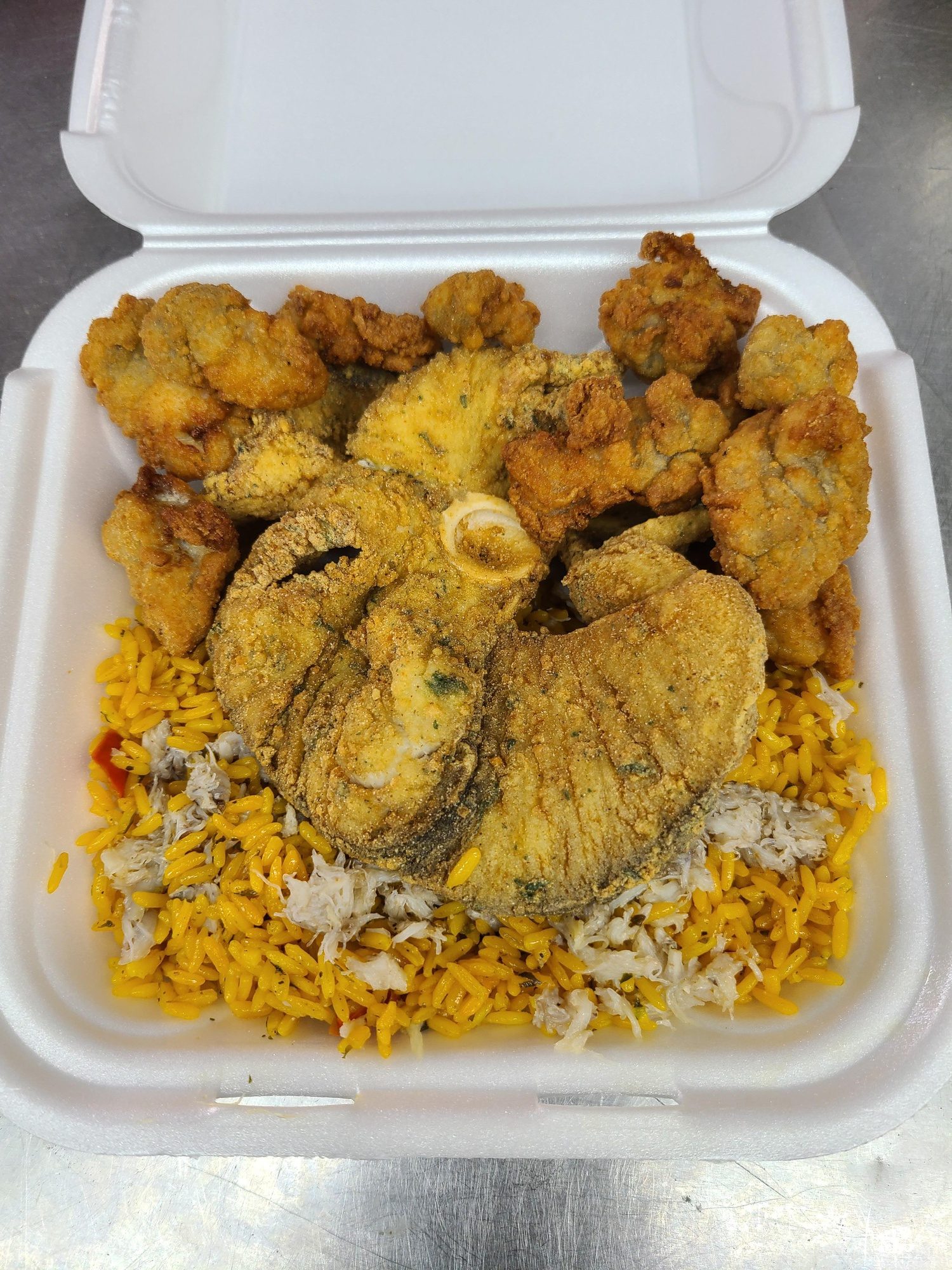 Garlic blue crabs over rice